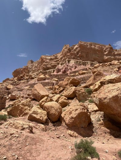 Majestic rocky desert terrain with clear blue sky, showcasing natural beauty.